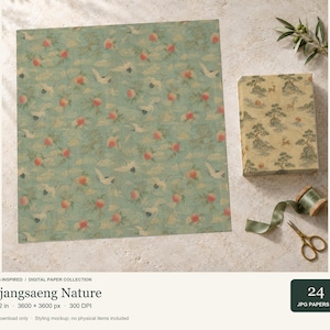 May include: A digital paper collection featuring a repeating pattern of white cranes, orange peaches, and gold clouds on a sage green background. A rectangular box with a landscape print, a green ribbon spool, and gold scissors are also shown.