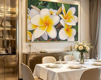 May include: A large framed painting of white and yellow plumeria flowers hangs above a dining table set for a meal. The room features a gold-toned cabinet, a glass display cabinet, and a vase of white roses.