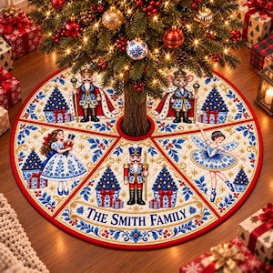 May include: A round, quilted Christmas tree skirt featuring a cream background with red and blue decorative borders. The design includes illustrations of nutcrackers, a mouse king, a girl, and a ballerina, with the text THE SMITH FAMILY.
