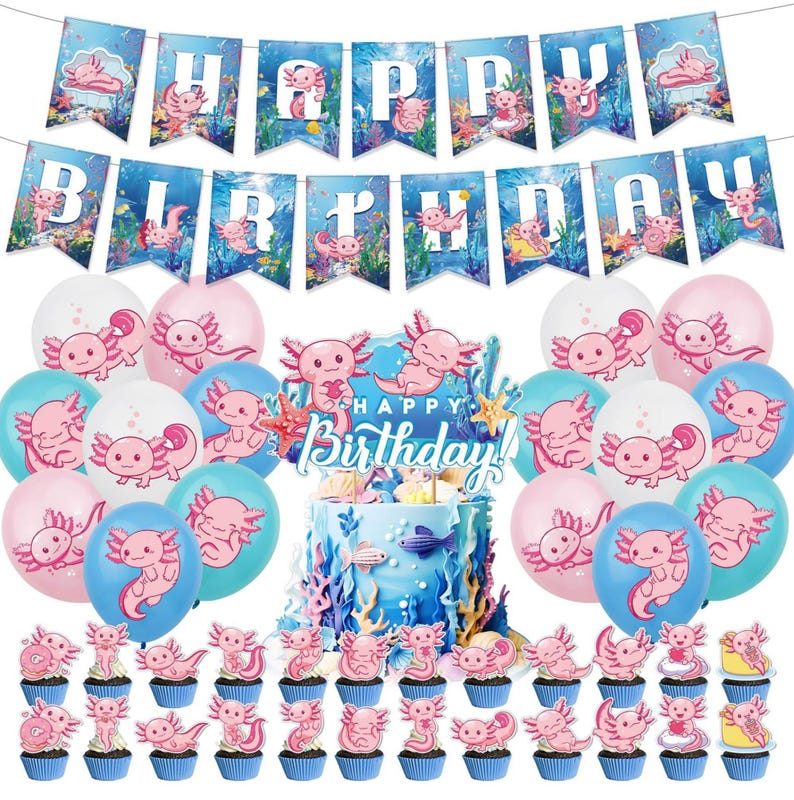 Op de afbeelding: Een feestelijke verjaardagsset met een taart, cupcakes, ballonnen en een banner. De decoraties zijn versierd met roze axolotl-illustraties en de woorden "Happy Birthday". De ballonnen zijn roze, wit en blauw.