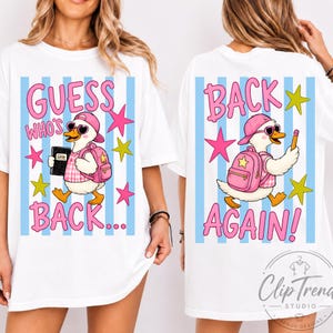 May include: A white t-shirt featuring a graphic of a duck wearing a pink cap, sunglasses, and a backpack. The front shows the duck with a notebook and the text "GUESS WHO'S BACK...". The back shows the duck with a pencil and "BACK AGAIN!".
