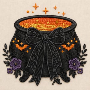 May include: An embroidered patch featuring a black cauldron filled with orange bubbling liquid, adorned with a large black bow, two orange bats, and purple flowers on each side. The design includes small orange stars and dots on a light fabric.