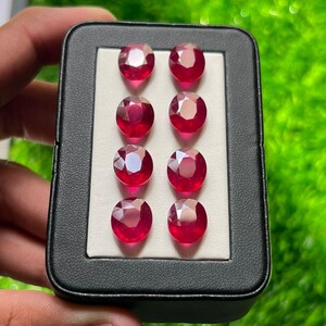 Rubino naturale di qualità AAA+ (riempito di vetro) 10 x 12 mm, taglio ovale sfaccettato – Colore rossastro – Lotto di pezzi disponibile – Gemma sfusa per gioielli