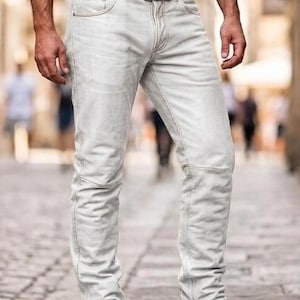 May include: Light grey denim jeans with a brown leather belt and brown leather shoes. The jeans have a classic five-pocket design and a straight leg fit. The belt has a silver buckle.