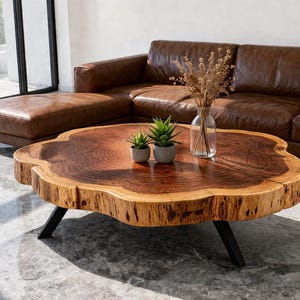 May include: A white ceramic mug with a black handle and the text "But First, Coffee" in a black, bold font. The mug is sitting on a white surface. The mug is approximately 4 inches tall.