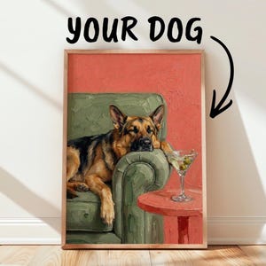 May include: A framed oil painting print featuring a German Shepherd resting on a green armchair next to a red side table with a martini glass. Above the artwork, the text YOUR DOG is displayed with a black arrow pointing down to the painting.