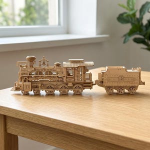 May include: A wooden model train with intricate details, including wheels, a smokestack, and a separate car. The train is made of light-colored wood and sits on a wooden table. The model train measures approximately 12 inches in length.