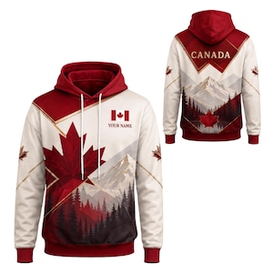 May include: A hooded sweatshirt featuring a red and white colour scheme with a large maple leaf graphic, a mountain and forest landscape print, the Canadian flag, and the text "YOUR NAME" on the front, with "CANADA" printed on the back.