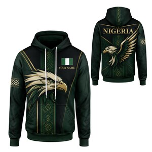May include: A dark green hoodie featuring a graphic of an eagle head, the Nigerian flag, and the text "YOUR NAME" on the front. The back displays the word "NIGERIA" above a large eagle graphic, with geometric patterns and gold accents throughout.