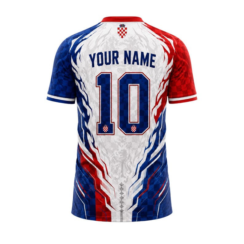 May include: A short-sleeved sports jersey featuring a red, white, and blue color scheme with a checkered pattern. The back displays the text YOUR NAME above the large number 10, with a small Croatian coat of arms emblem at the neckline.