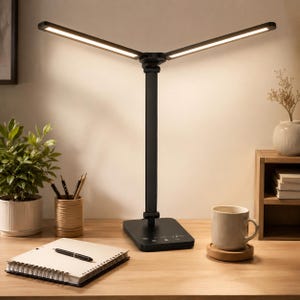 May include: A black LED desk lamp with a central vertical stand and two adjustable, outward-extending light bars that emit a warm glow. The base features a flat, rectangular control panel with touch-sensitive icons for adjusting light settings.