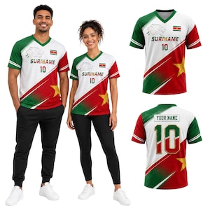 May include: A V-neck sports jersey featuring the Suriname flag colors of green, white, and red with a yellow star. The front displays a jaguar graphic, the text SURINAME, and the number 10. The back shows the text YOUR NAME and the number 10.