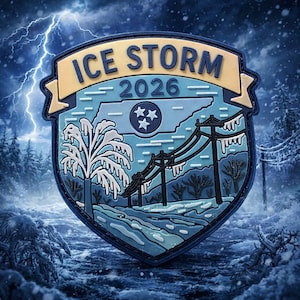 May include: A shield-shaped patch with the text "ICE STORM 2026" in blue and gold. The design features a winter landscape with a tree, power lines, and the outline of Tennessee, with a lightning storm in the background.