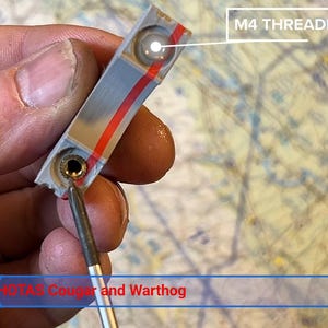 May include: A gray rectangular component with a red stripe and a brass M4 threaded insert. A metal tool is inserted into the brass fitting. The text M4 THREADED INSERTS is visible in the upper right, and HOTAS Cougar and Warthog is at the bottom.