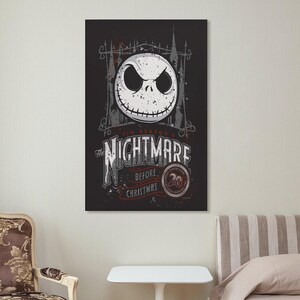 May include: A rectangular wall art print featuring the character Jack Skellington from "The Nightmare Before Christmas." The artwork has a black background with the film's title and a 20th-anniversary emblem. The image includes a white, smiling skull.
