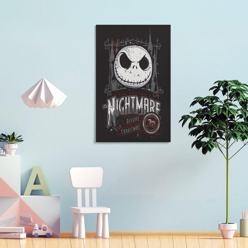 May include: A framed poster featuring Jack Skellington from "The Nightmare Before Christmas." The artwork has a distressed, vintage look with a black background, a white skull, and the film's title in a stylized font. The poster is displayed on a light blue wall.