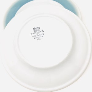 May include: A rustic wooden sign with the text "Welcome to our home" in white lettering. The sign features a distressed finish and a simple, inviting design, perfect for front door decor.