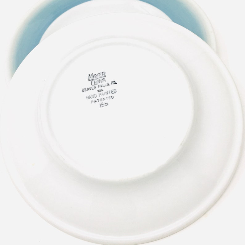 May include: A rustic wooden sign with the text "Welcome to our home" in white lettering. The sign features a distressed finish and a simple, inviting design, perfect for front door decor.