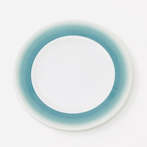 May include: A set of three ceramic vases in varying heights. The vases are white with a textured, ribbed design. The tallest vase is approximately 10 inches tall, the medium vase is 8 inches, and the smallest is 6 inches.