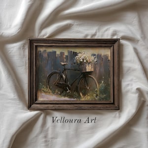 May include: A framed painting depicts a vintage bicycle with a basket of white flowers. The bicycle is parked in front of a wooden fence. The artwork has a rustic, vintage aesthetic, with the text "Velloura Art" at the bottom.
