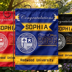 May include: Three graduation garden flags in red, blue, and black. The blue flag features the name "SOPHIA", the text "Congratulations", and "Class of 2026" with the Redwood University logo. The red and black flags have similar designs.