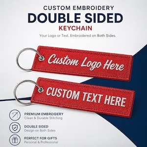 May include: Red, double-sided custom embroidered keychains with silver key rings. The keychains have white text that reads "Custom Logo Here" and "Custom Text Here". The image also includes the text "Custom Embroidery", "Double Sided Keychain", and "Premium Embroidery".