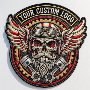 May include: Embroidered patch with a skull in a motorcycle helmet and goggles, wings, and pistons. The patch is black, red, gold, and white, with the text "YOUR CUSTOM LOGO" in a banner across the top.