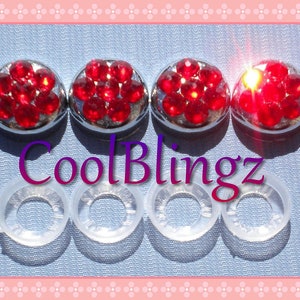 May include: Set of four red rhinestone car emblems with clear plastic backing. The emblems are round and have a silver base. The text "CoolBlingz" is visible in the image.