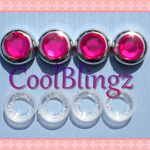 May include: Four chrome-plated, pink rhinestone car emblems with four clear plastic backing rings. CoolBlingz is written in purple text.