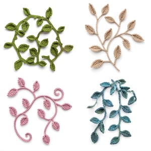 May include: Four crocheted leaf designs in shades of green, tan, pink, and blue. The green design is circular, the tan is a branch, the pink has a spiral, and the blue is a hanging vine. Each has detailed leaf shapes.