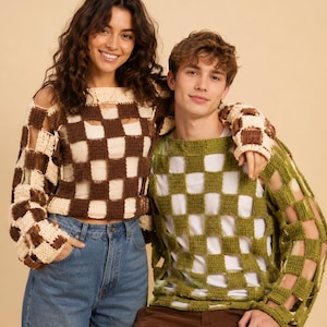 May include: A long-sleeve crochet sweater featuring a brown and cream checkered pattern worn over a white top, and a long-sleeve crochet sweater featuring an olive green checkered pattern worn over a white top, paired with blue denim jeans.