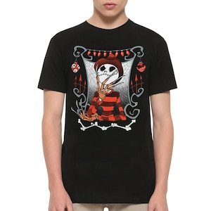 May include: A black short-sleeve t-shirt featuring a graphic print of a skeletal figure with long blade fingers, wearing a brown hat and a red and black striped sweater. The design includes a spiderweb background, red string lights, and bones.