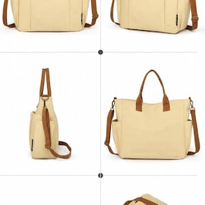 May include: Beige canvas tote bag with brown accents. Features include a top handle, shoulder strap, and multiple pockets. The bag has a rectangular shape and a small label on the front. The text "ANGLE + ANGLE DISPLAY" is visible.