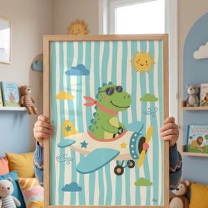 May include: A framed vertical wall art print featuring a green dinosaur wearing sunglasses and a red scarf, piloting a white and blue airplane. The background consists of light blue and white vertical stripes with yellow sun and cloud illustrations.