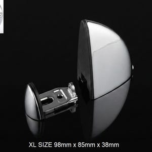 May include: A chrome-finished metal door stop with a semi-circular design and a black rubber bumper. The hardware includes a mounting bracket with visible screw holes. The text reads XL SIZE 98mm x 85mm x 38mm and the logo HiProgress is visible.