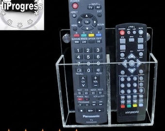 DOS controles remotos para receptor decodificador de TV por cable o satélite, soporte de pared para exhibición.