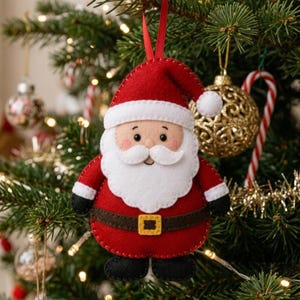 May include: A handmade Christmas tree ornament shaped like Santa Claus. The ornament is made of red felt with white trim, a white beard and mustache, and a brown belt with a gold buckle. The ornament is hanging from a red ribbon.