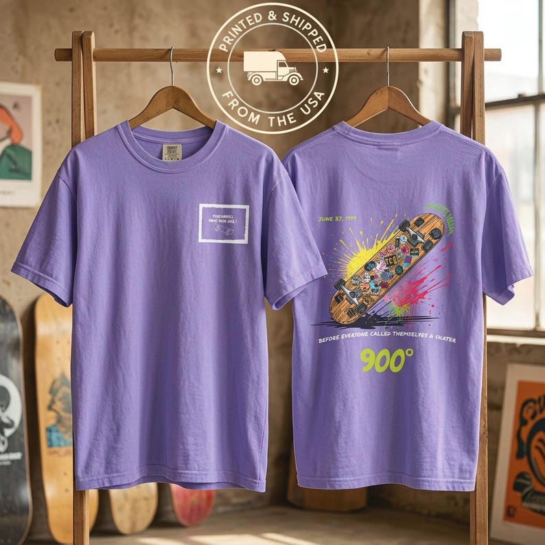Vintage 900 Degrees Skateboard Shirt in black, flat lay product shot with lifestyle accessories. Comfort Colors 1717 heavyweight cotton tee with Four Wheels Move The Soul front chest print. Printed and shipped from the USA. Retro skate graphic shirt folded showing front print detail. Old school skate culture gift idea for men and women. Double sided print vintage skateboard tee