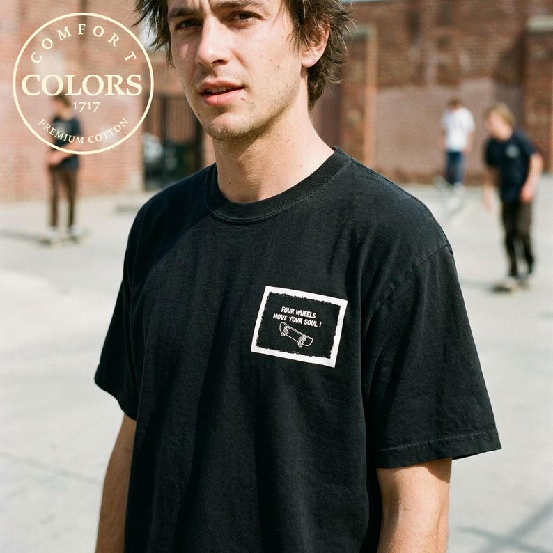 Vintage 900 Degrees Skateboard Shirt in black worn at a skatepark bowl, back print full view. Retro skate graphic tee on Comfort Colors 1717 with neon yellow 900 degree design and graffiti background. Before Everyone Called Themselves A Skater. Double sided print heavyweight skate shirt. Perfect gift for skateboarders and 90s skate culture fans who love old school street skating aesthetic