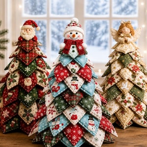 May include: Three decorative fabric Christmas trees featuring layered, quilted triangular patches. The left tree is topped with a Santa Claus figure, the center with a snowman, and the right with an angel. Each tree displays festive holiday patterns.