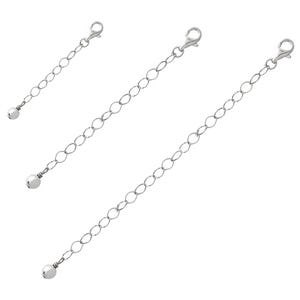 May include: Three silver-toned chain extenders with lobster claw clasps and small ball accents. The extenders are of varying lengths, designed to add length to necklaces or bracelets. The chains are made of small, oval-shaped links.