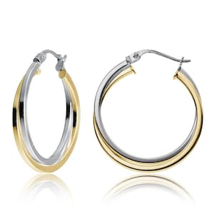 May include: Two hoop earrings with a dual-tone design. Each earring features a silver-colored metal intertwined with a gold-colored metal, creating a layered effect. The earrings are oval-shaped and have a polished finish, reflecting light.