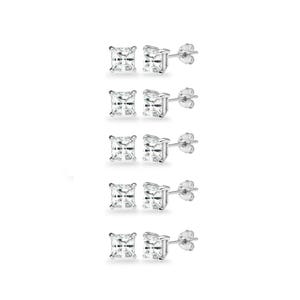 May include: Five pairs of square-cut, clear cubic zirconia stud earrings with silver posts and butterfly backs. The earrings are displayed against a white background, showcasing their sparkling facets.