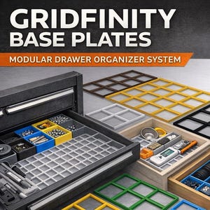 May include: Modular drawer organizer system with Gridfinity base plates. The image showcases various 3D-printed base plates in multiple colors, including black, white, gray, red, blue, and yellow. The text reads "Custom 3D Printed" and "100% USA Made".