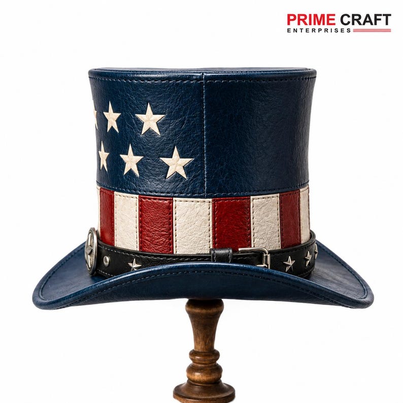 May include: A top hat featuring a blue crown with white stars and a body with red and white vertical stripes. A black leather-like band with silver star studs and a metal buckle encircles the base. The brim is blue, and the text PRIME CRAFT ENTERPRISES appears above.