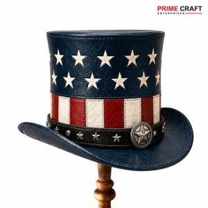 May include: A top hat featuring a blue crown with white stars over red and white vertical stripes. A black band with silver star studs and a large central star emblem encircles the base. The brim is blue, and the text PRIME CRAFT ENTERPRISES appears.