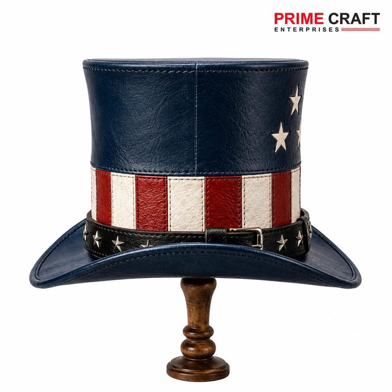 May include: A top hat featuring a blue crown with white stars and a red and white striped base. A black leather-like band with silver star studs and a metal buckle encircles the base. The text PRIME CRAFT ENTERPRISES appears in the top corner.
