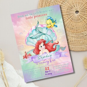 May include: A colorful invitation featuring Ariel from The Little Mermaid, a seashell, and a yellow fish. The invitation reads "Join us to celebrate our little princess" and "Sophia is turning five."