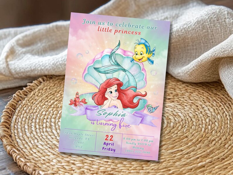 May include: A colorful invitation featuring a mermaid, a seashell, and a yellow fish. The invitation reads "Join us to celebrate our little princess" and "Sophia is turning five". The date is April 22nd.