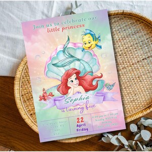 May include: A colorful invitation featuring a mermaid, a seashell, and a yellow fish. The invitation reads "Join us to celebrate our little princess" and "Sophia is turning five." Additional text includes the date, time, and location.